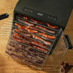 Excalibur 10 Tray Select dehydrator loaded with meat strips for making biltong or jerky.