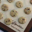 Unbaked cookies with chocolate chips on an Excalibur ParaFlexx Ultra silicone non-stick sheet.