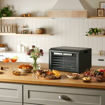Lifestyle layout showing a variety of dried foods, fruit and snacks made with the Excalibur 6 Tray Select Series.